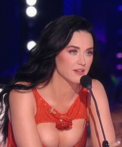 Katy Perry Stuns In Orange dress With Cutouts for American Idol finale