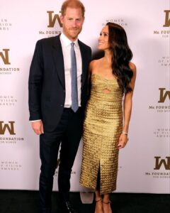 Meghan Markle in gold gown with Surprise Guests Prince Harry for post-coronation award
