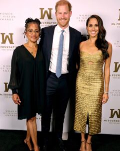 Meghan Markle in gold gown with Surprise Guests Prince Harry for post-coronation award