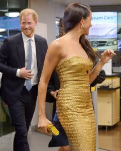 Meghan Markle in gold gown with Surprise Guests Prince Harry for post-coronation award